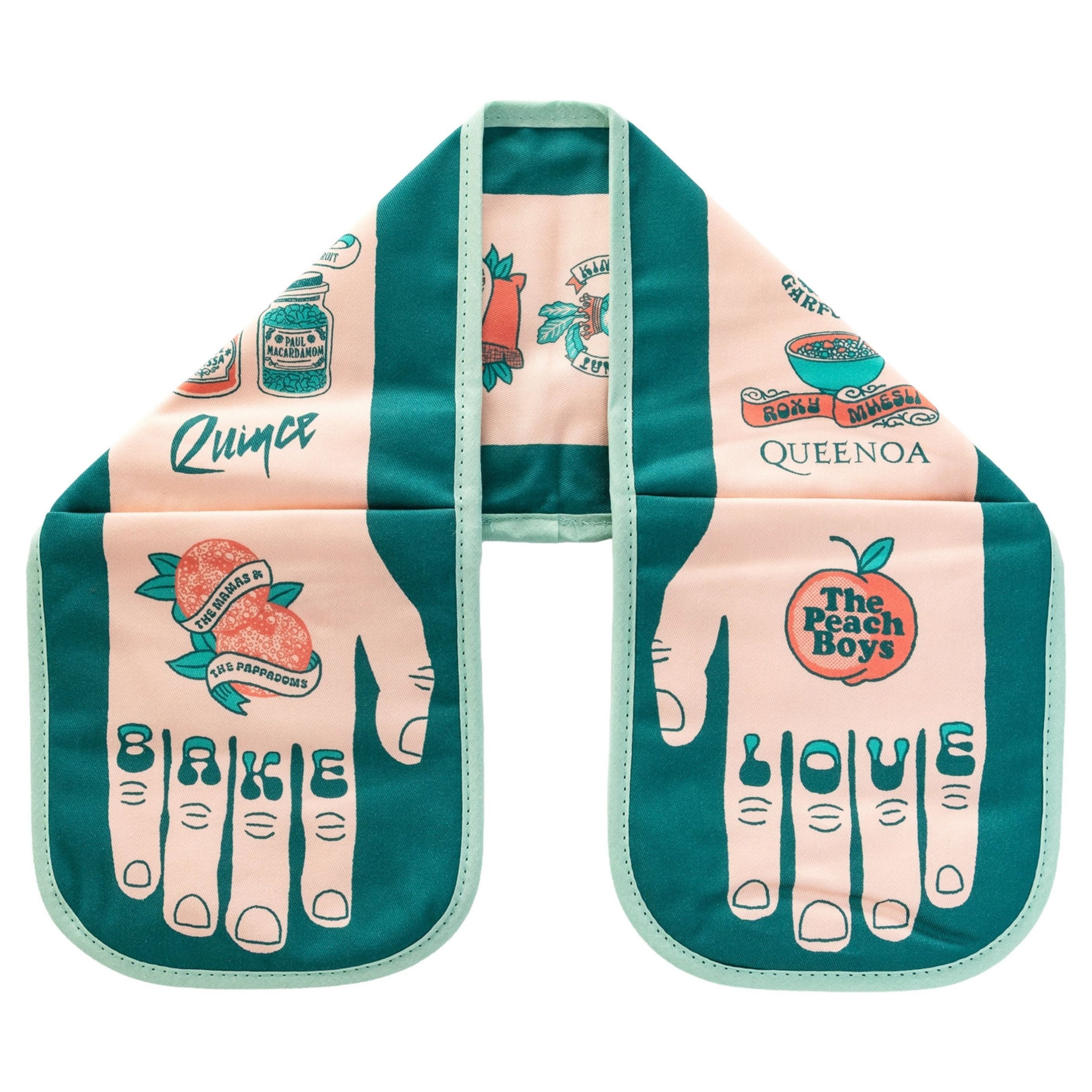Bake Love double oven glove with teal and peach illustrated food-and-music puns and the words “BAKE” and “LOVE” on the fingertips, displayed flat on a white background.