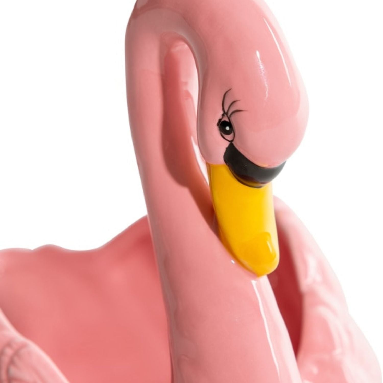 Close-up of glossy pink swan ceramic planter with yellow beak and sculpted detail on a white background, elegant home decor by Lizzie Onion’s Emporium.