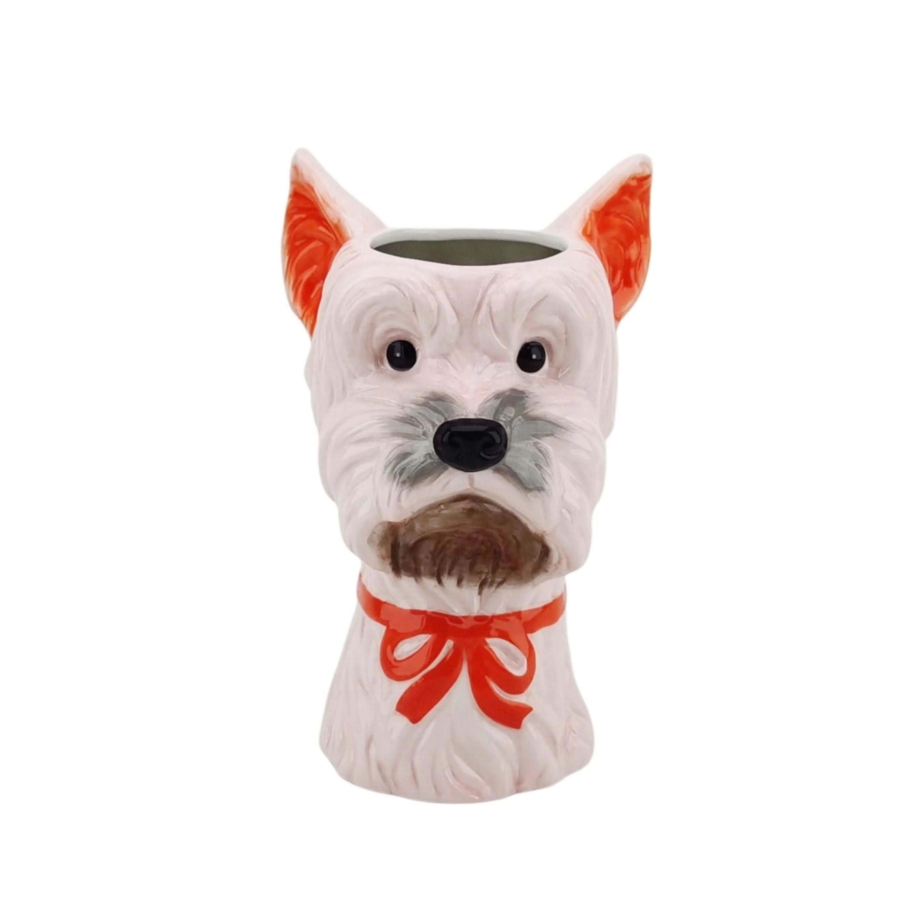 Dog-shaped ceramic flower vase in pink and orange with a bow, playful animal vase for colourful home decor