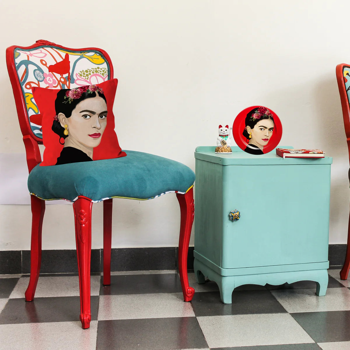 Frida Kahlo inspired decorative plate styled on a side table in a colourful interior setting