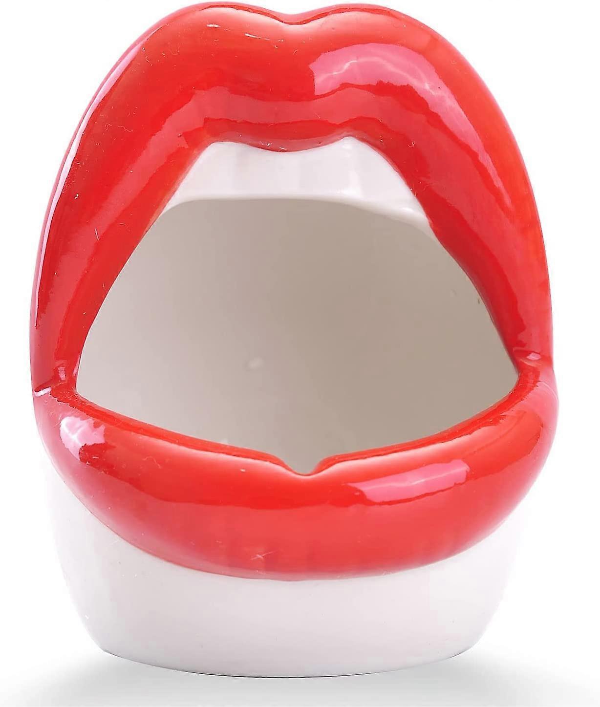 Glossy red lip-shaped ceramic pot with white base – statement home décor piece by Lizzie Onion’s Emporium