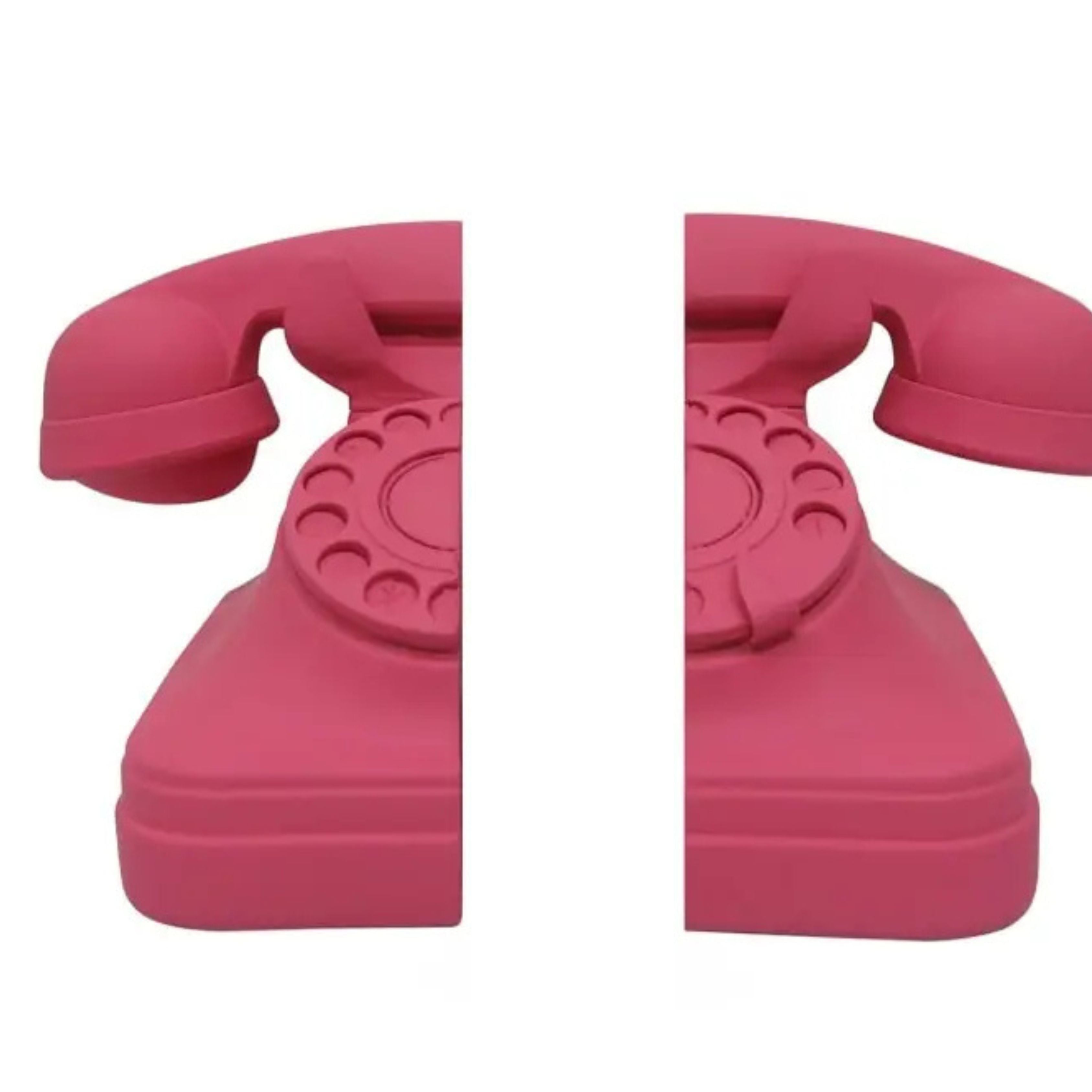 Matt pink red retro telephone bookends split rotary phone design on white background