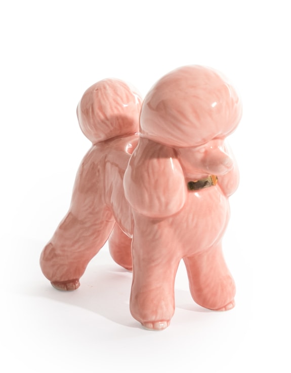 Pink ceramic poodle candle holder with gold collar detail on white background