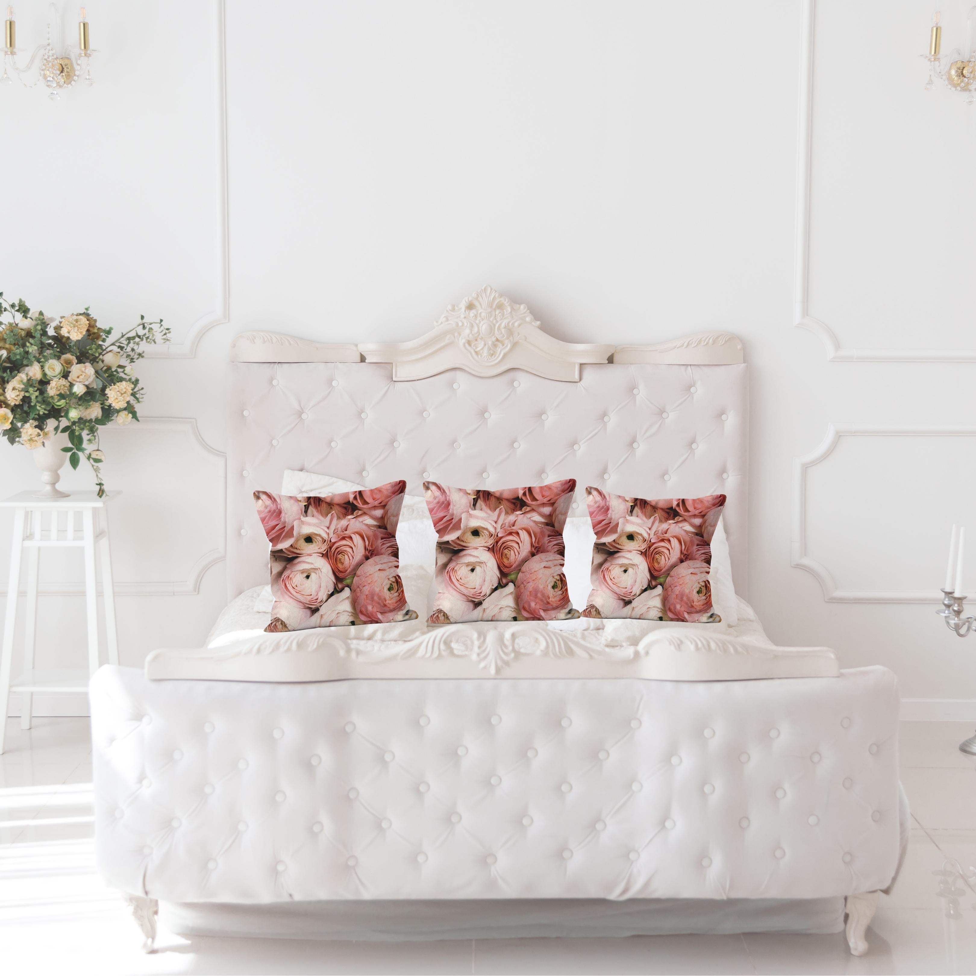 Roses in Shades of Pink cushions displayed on a white tufted bed in an elegant bedroom – Lizzie Onion’s Emporium