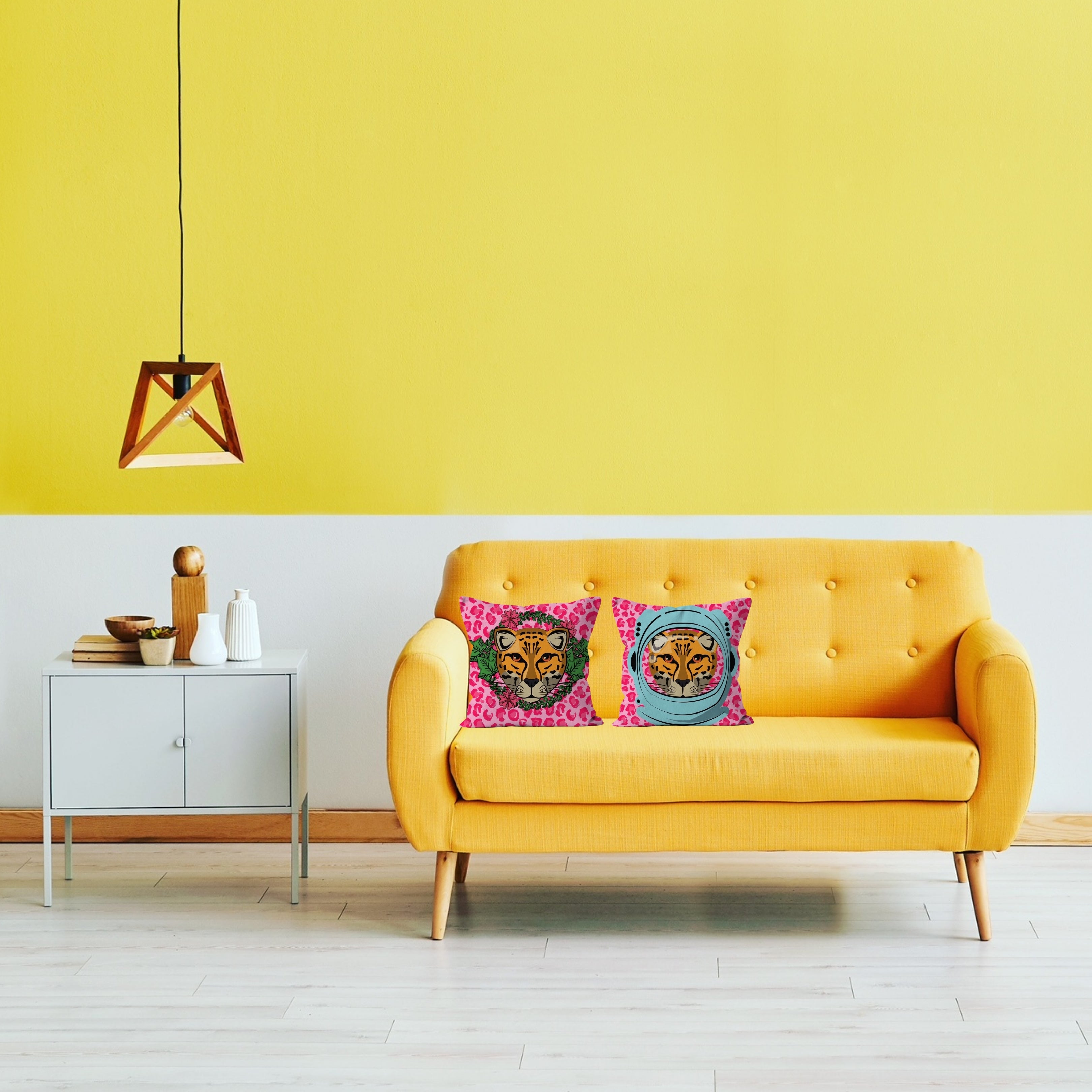 Set of Leopard portrait cushions on pink sofa – Astronaut, Trend-Setting, Roaring, and Garlands designs from Lizzie Onion’s Big Cat Collectio