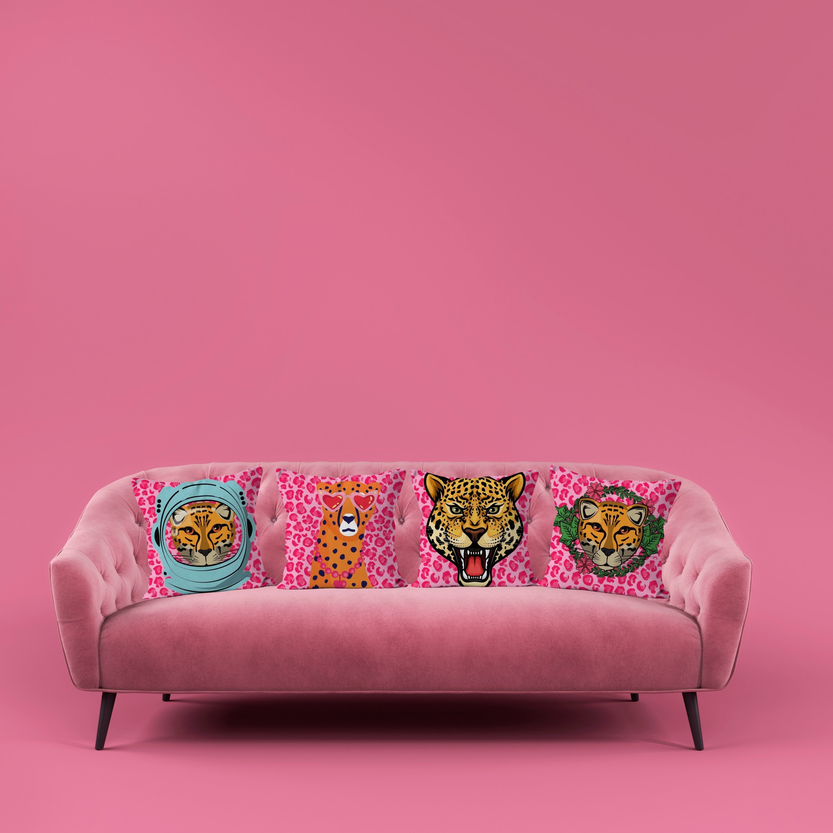 Set of Leopard portrait cushions on pink sofa – Astronaut, Trend-Setting, Roaring, and Garlands designs from Lizzie Onion’s Big Cat Collection