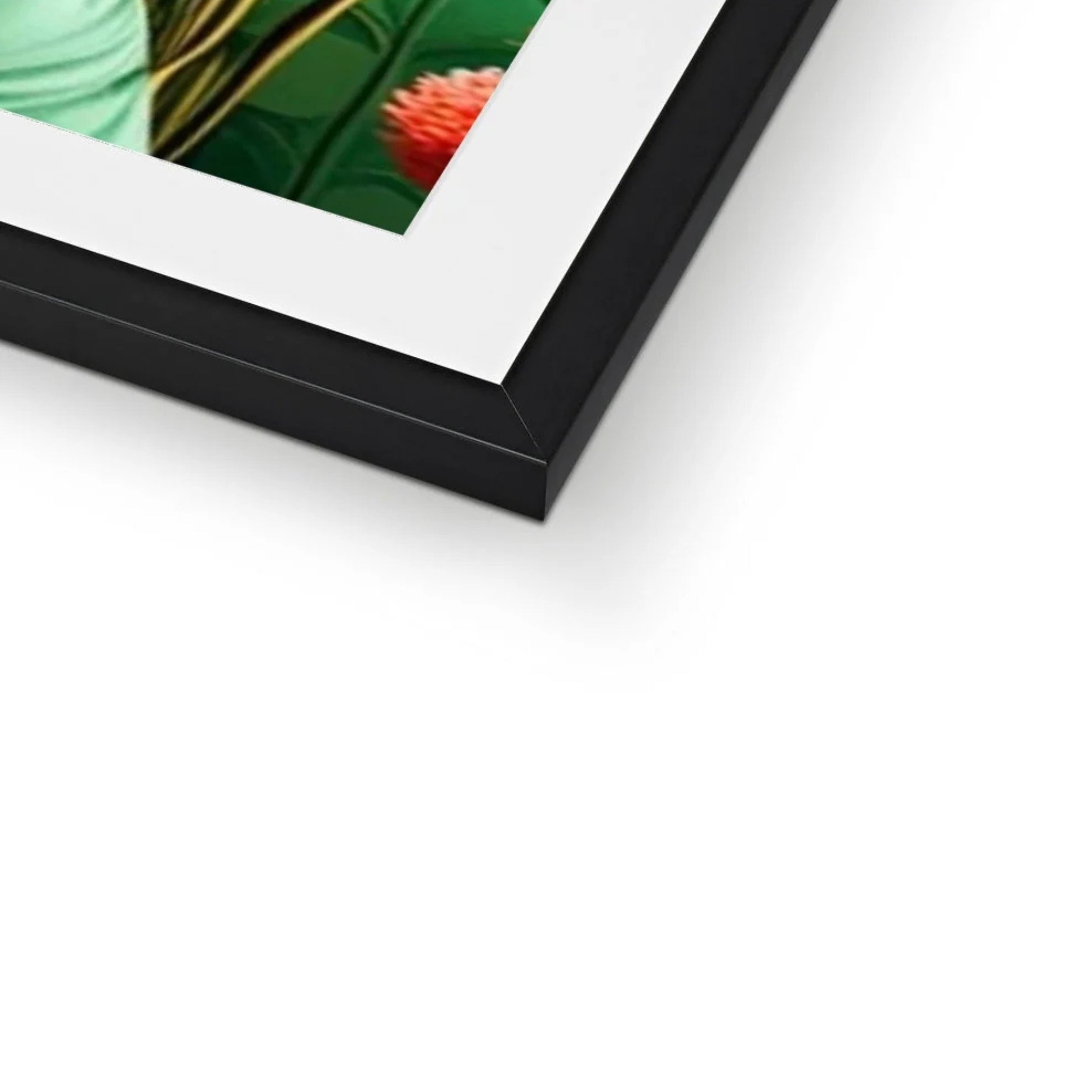 Close-up detail of the Élodie – Garden Reverie black framed print, highlighting the premium black frame, crisp white mount and vibrant botanical artwork in emerald green, coral and blush pink tones.