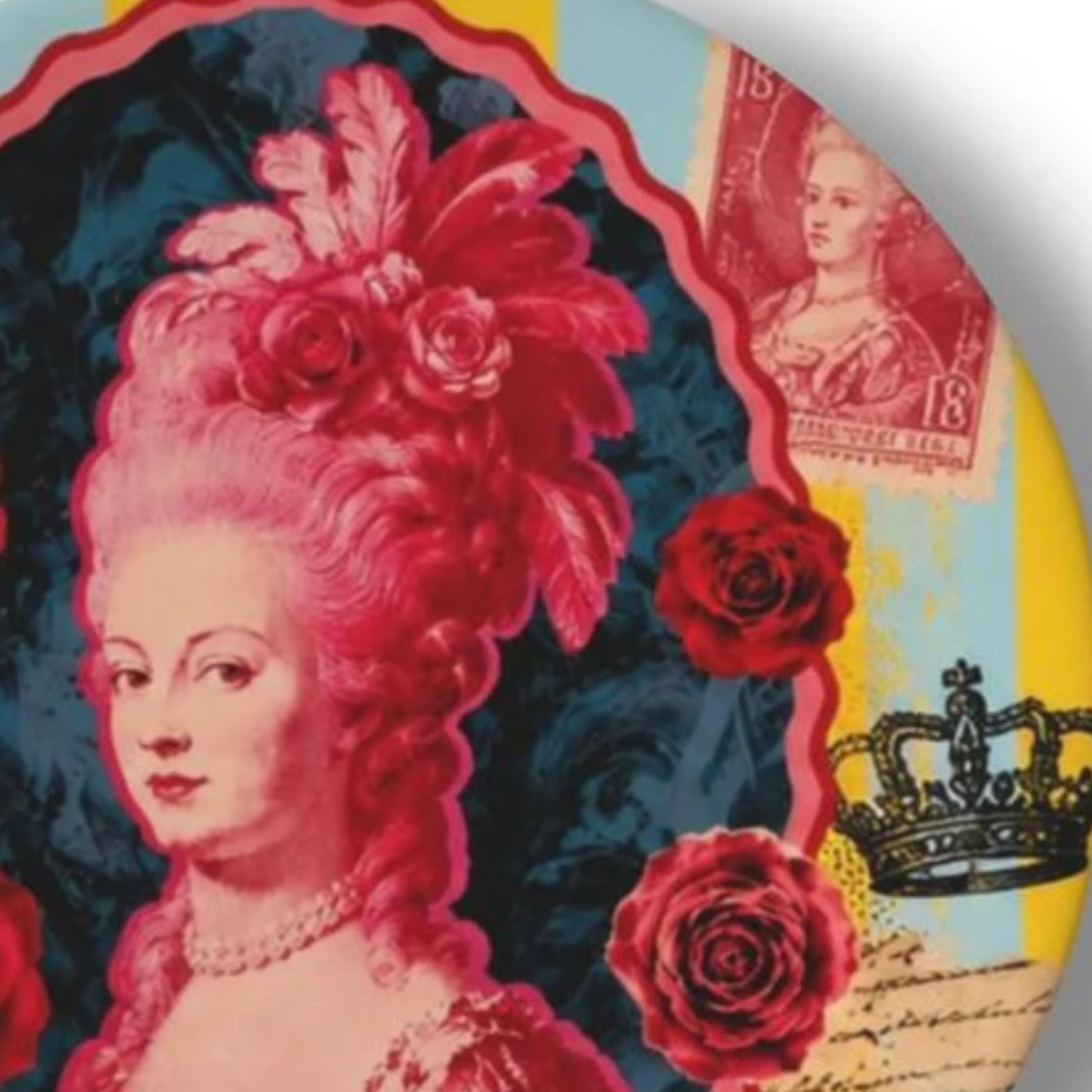 Close-up of Marie Antoinette pop art decorative plate with pink portrait roses crown vintage postage stamp and colourful collage background