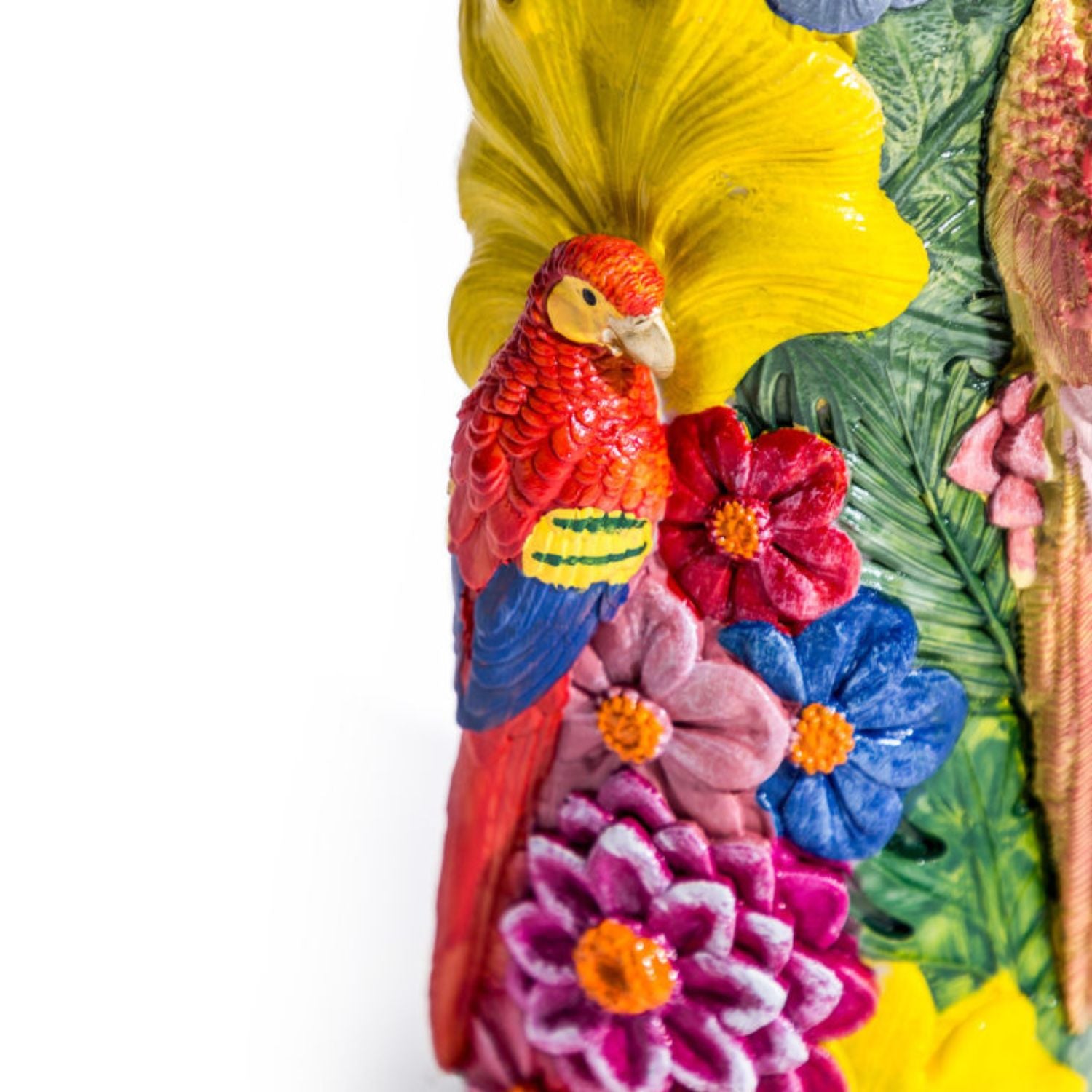 Close-up of colourful parrot detail surrounded by bright tropical flowers and leaves on the vibrant floral bird vase, decorative statement piece by Lizzie Onion’s Emporium.