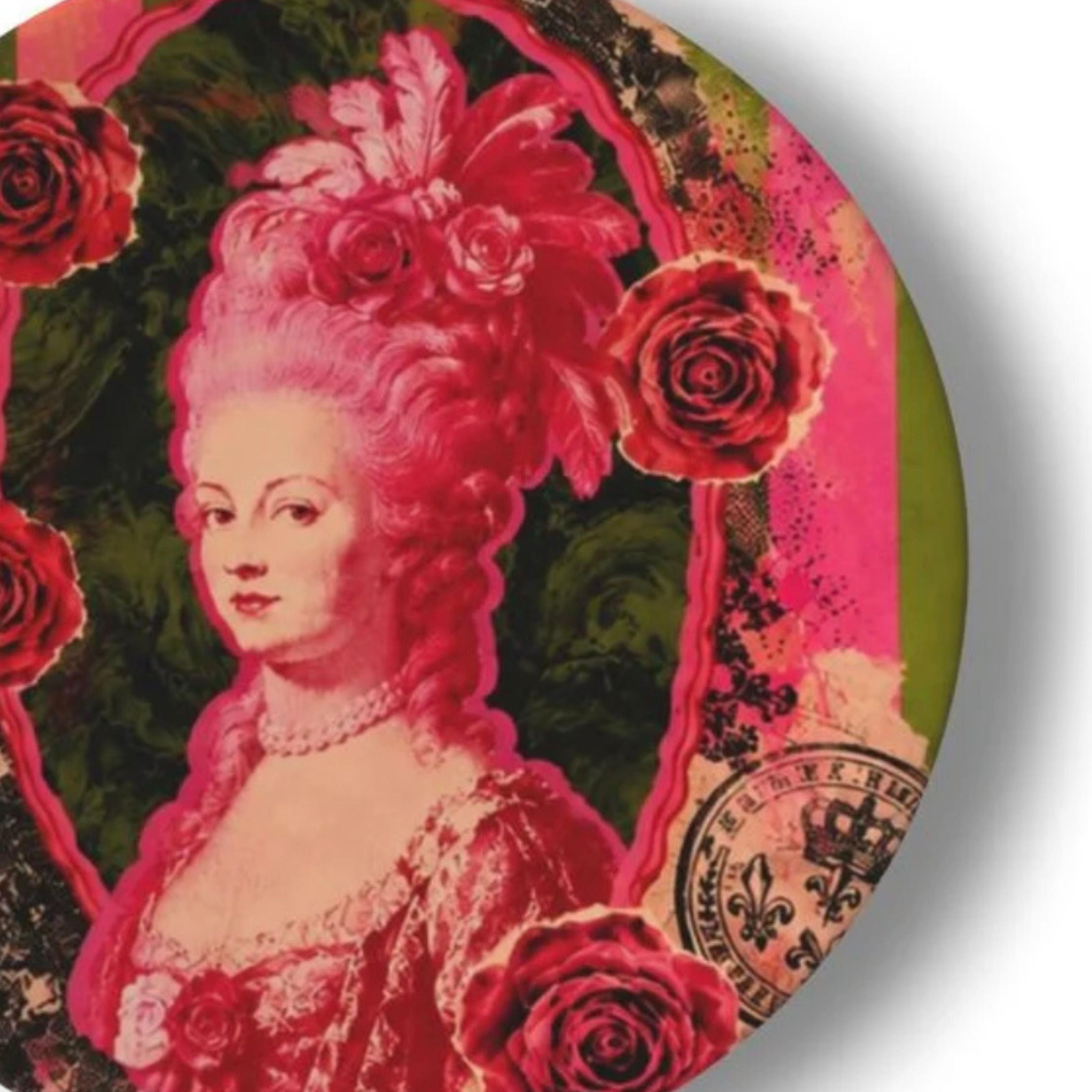 Close up of Marie Antoinette pop art decorative plate with pink portrait roses ornate crest detail and layered vintage collage background