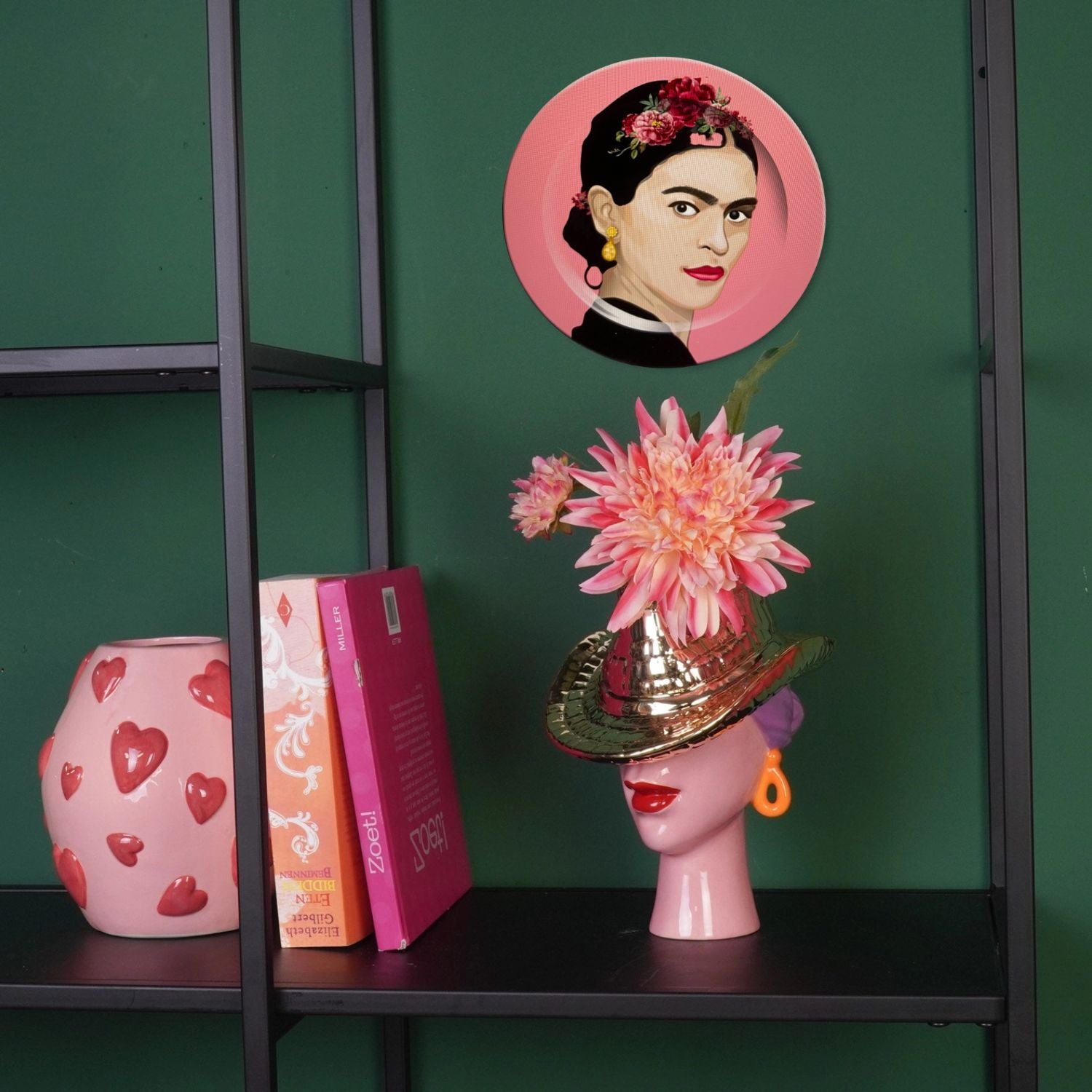 Gold cowboy hat lady vase styled on a dark green shelf with pink flowers and a Frida-inspired art print – eclectic maximalist décor by Lizzie Onion’s Emporium