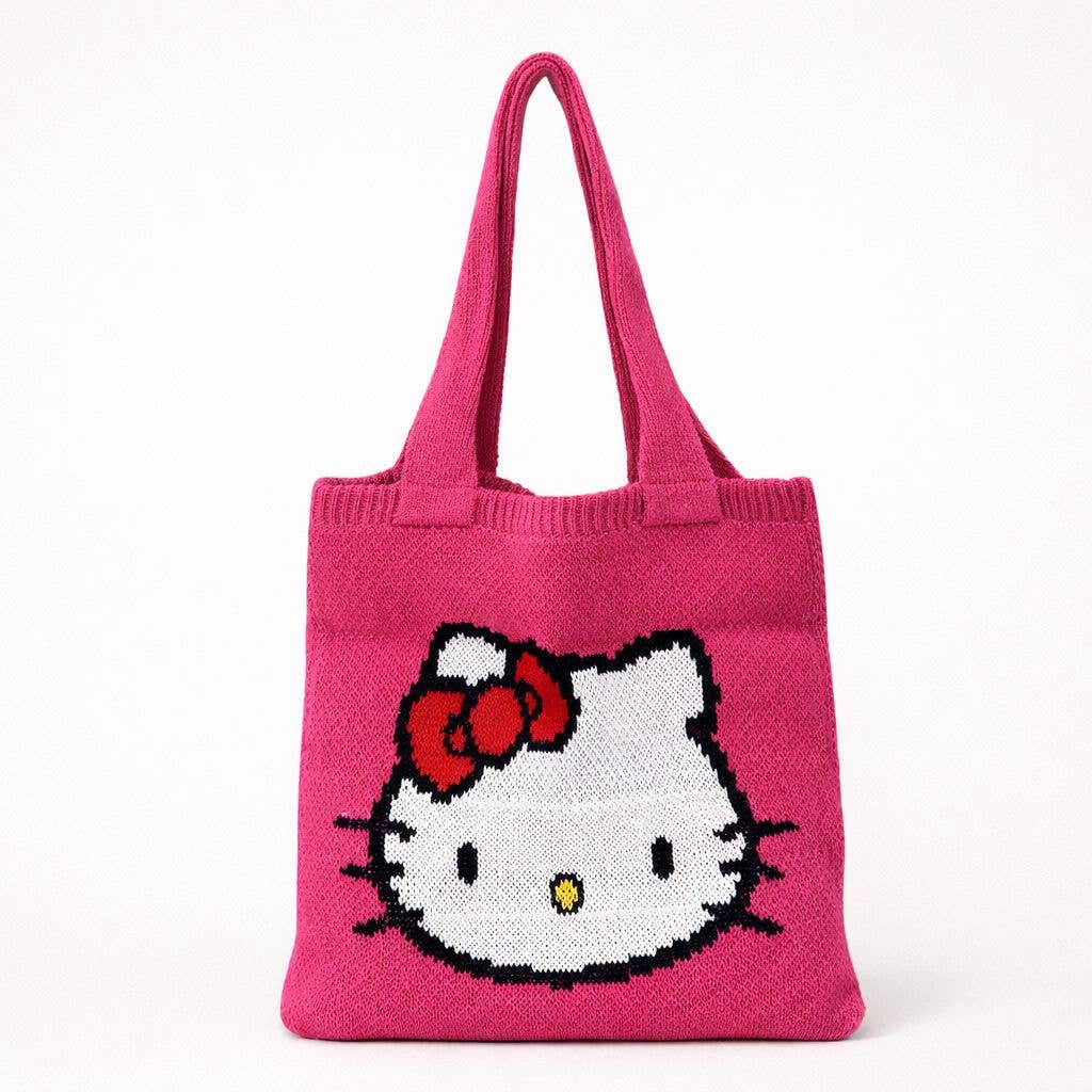 Pink knitted Hello Kitty tote bag with an iconic Hello Kitty face and red bow on the front, photographed against a clean white background with a soft natural shadow.