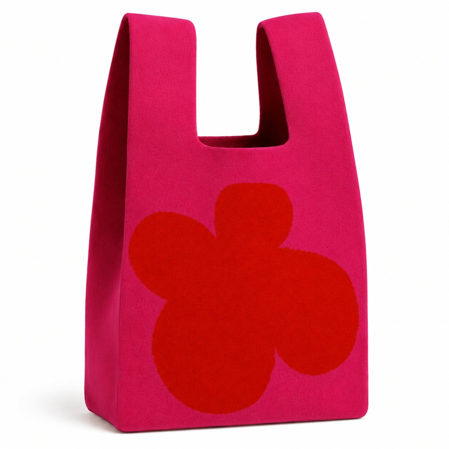 Pop Petal Tote Bag in bright pink knitted fabric featuring an oversized red floral design, photographed on a white background.