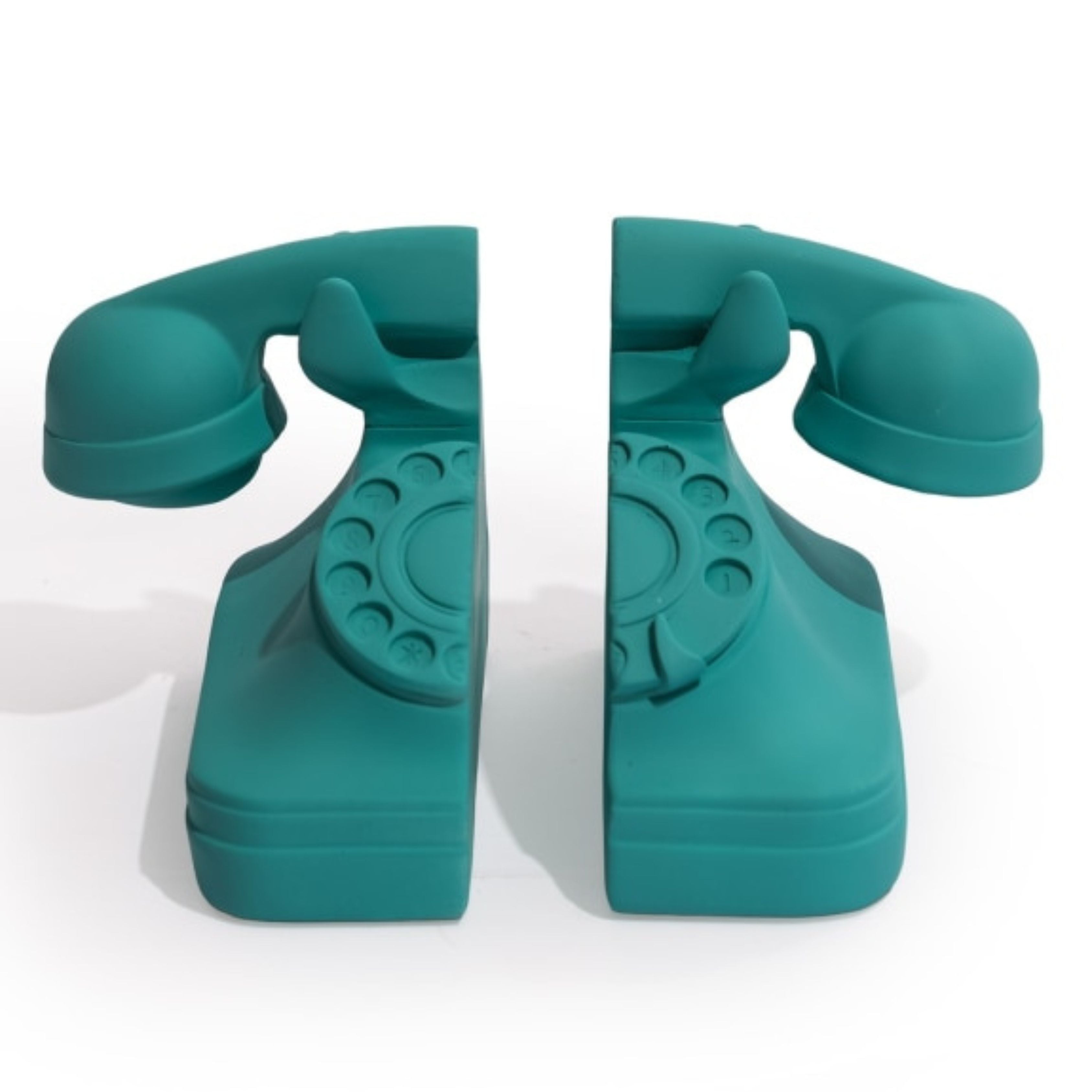 Set of matt aqua blue retro telephone bookends on white background