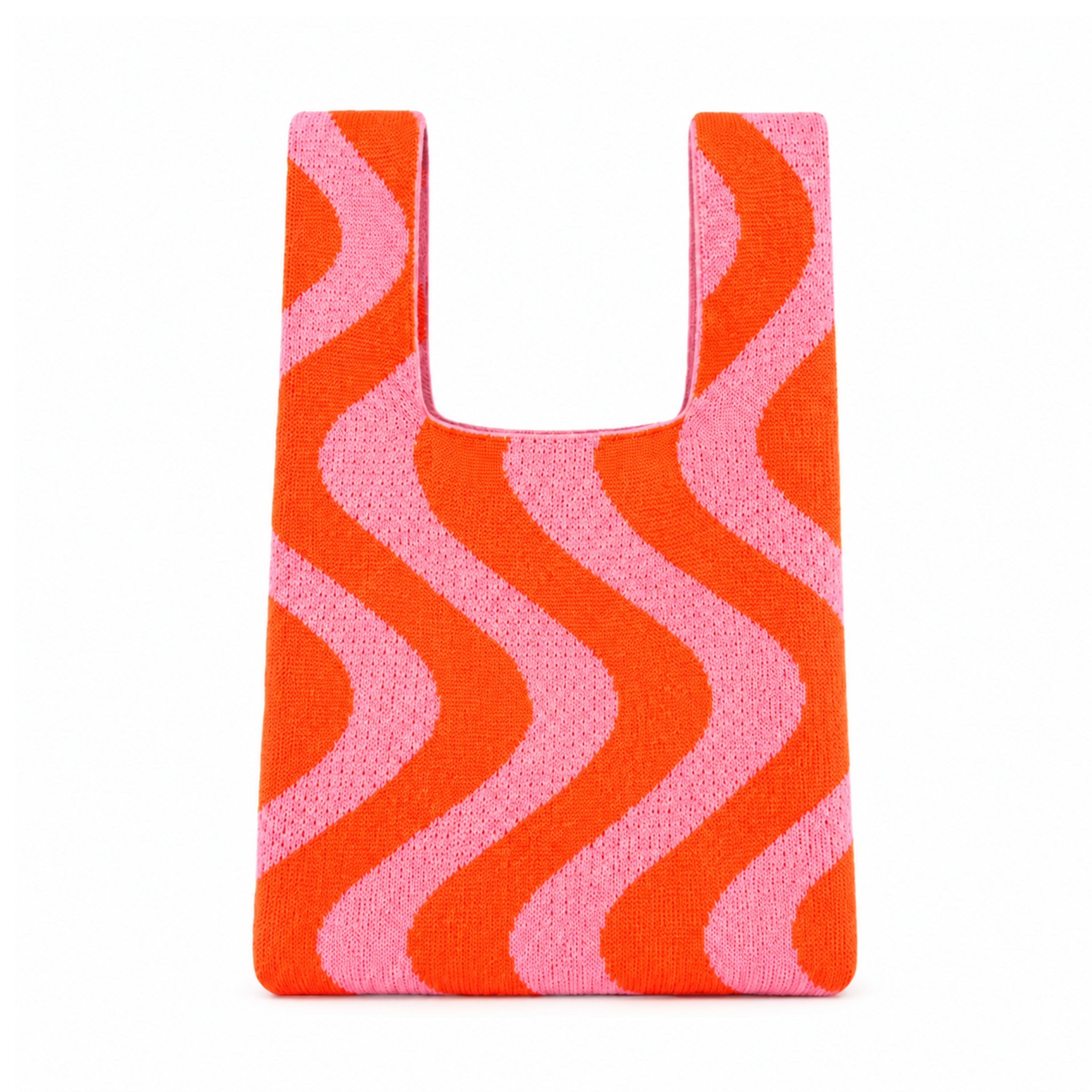 Sunset Swirl Knitted Bag in coral orange and candy pink with a bold retro-inspired wavy stripe pattern. Lightweight knitted tote bag with integrated handles on a white background.