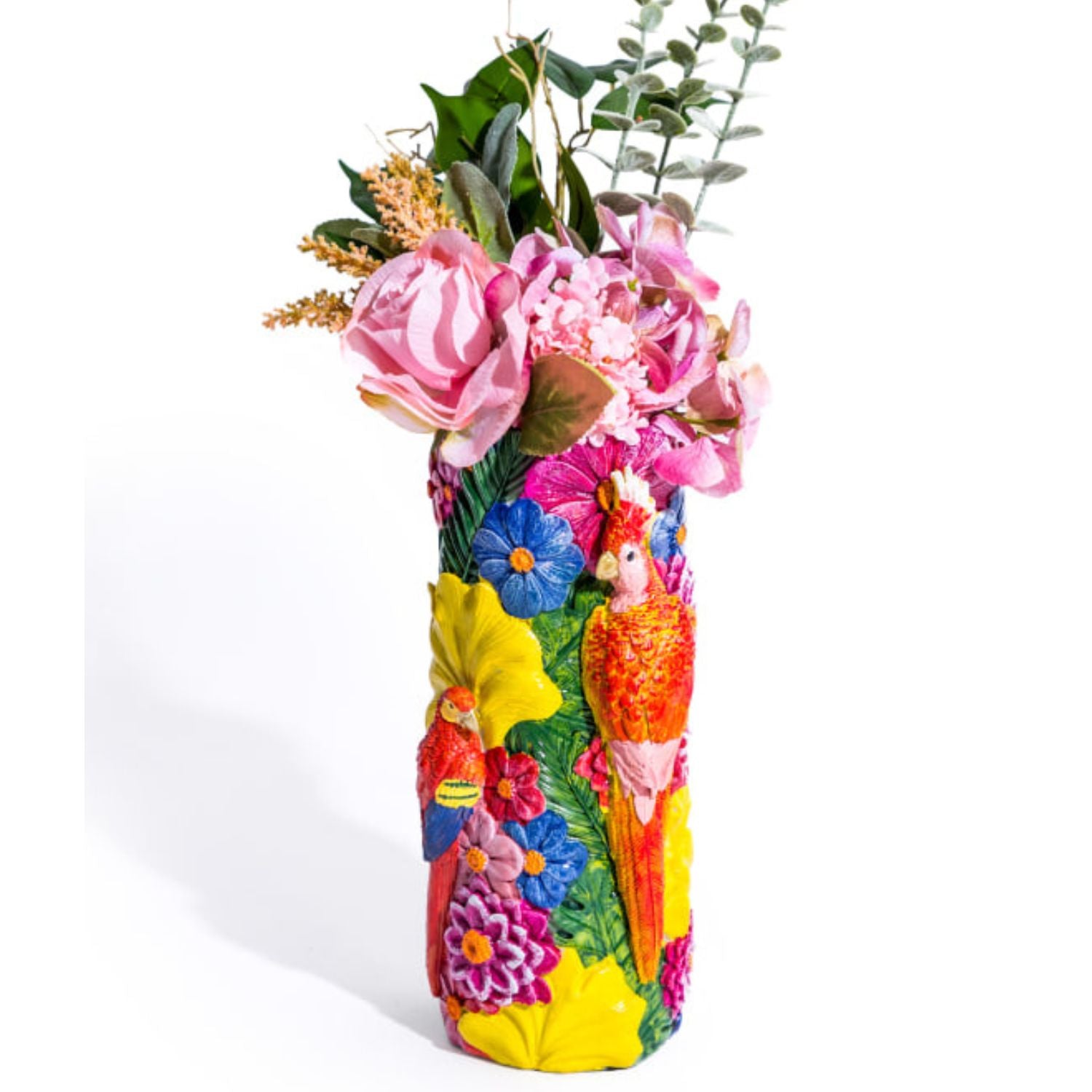 Vibrant floral bird vase filled with pink and green flowers on a white background, featuring colourful parrots and tropical blooms, bold home decor by Lizzie Onion’s Emporium.