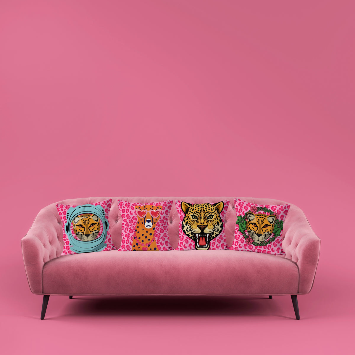 Four leopard portrait cushions displayed on a pink sofa in a maximalist interior Lizzie Onions Big Cat Collection